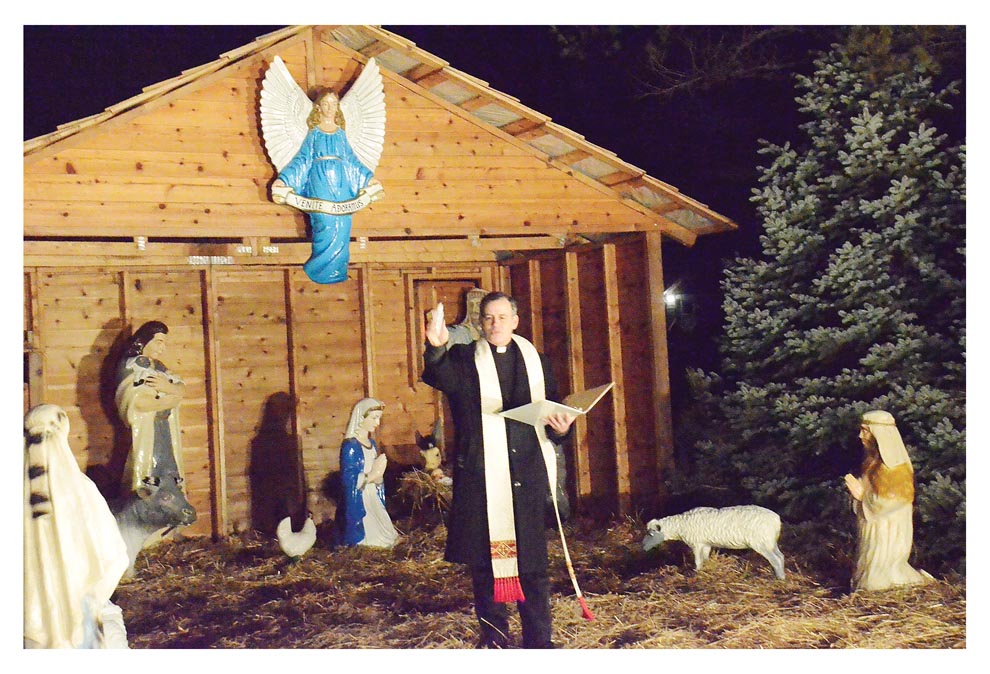 Crib blessing at Lehnertz Avenue Christmas story display The Voice